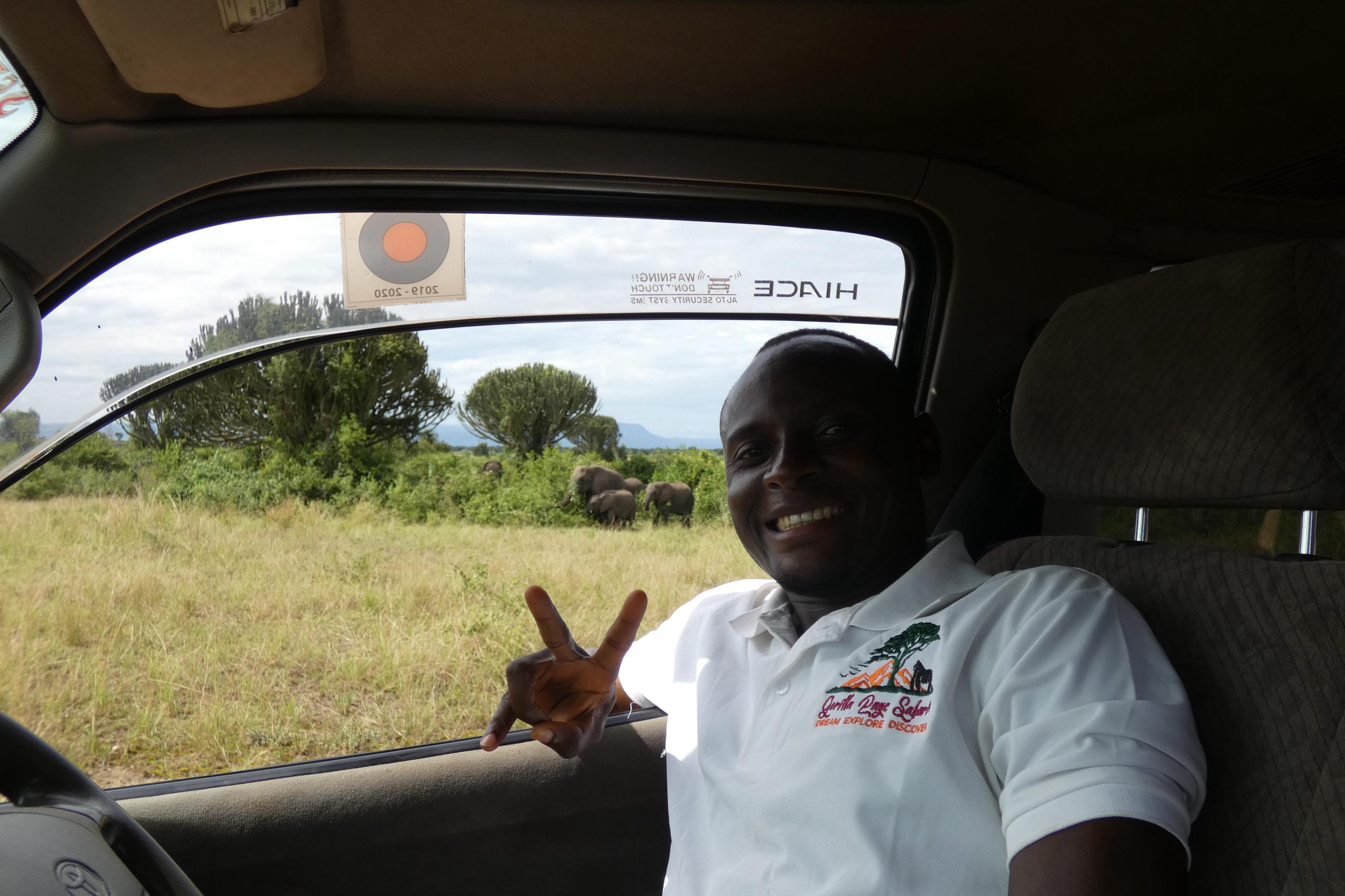 Isaac in Queen Isaac our guide on a Game drive in Queen Elizabeth National Park
